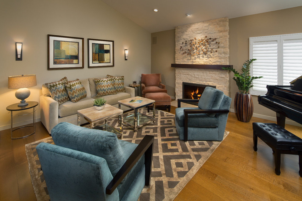 Photo of a mid-sized contemporary open concept living room in Orange County with beige walls, a standard fireplace and a stone fireplace surround.