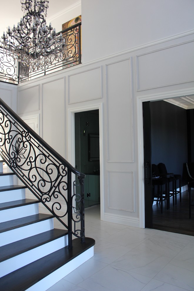 Photo of a large traditional foyer in Melbourne with grey walls, porcelain floors, a double front door and a black front door.