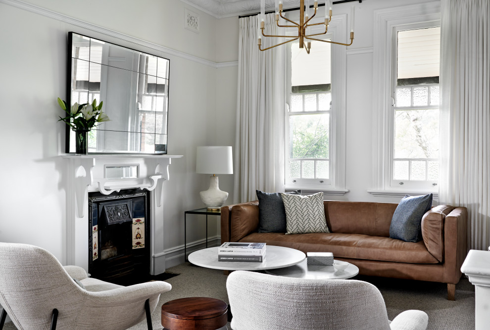 Inspiration for a mid-sized transitional formal open concept living room in Sydney with white walls, carpet, a standard fireplace, a metal fireplace surround, no tv and grey floor.