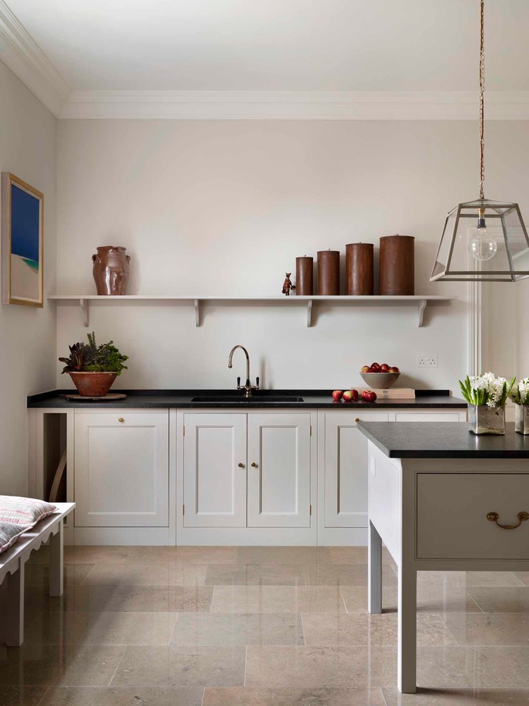 Inspiration for a transitional kitchen in London with an undermount sink, recessed-panel cabinets, with island and grey cabinets.