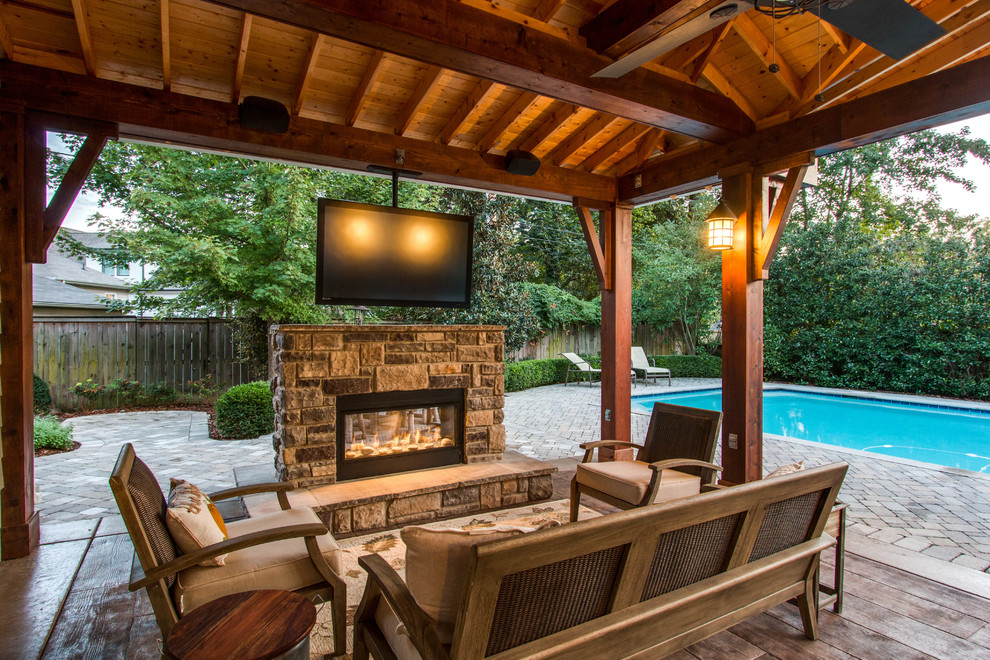 Photo of a large country backyard patio in Nashville with a fire feature, decking and a pergola.