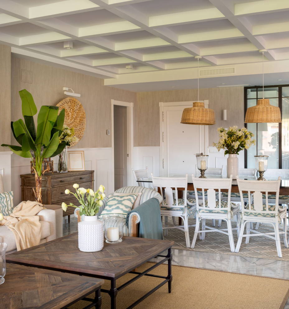 Ejemplo de comedor marinero grande abierto con paredes beige, suelo de mármol, todas las chimeneas, suelo gris, casetón, papel pintado y alfombra