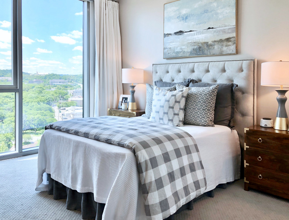 Example of a transitional guest carpeted and beige floor bedroom design in Nashville with beige walls