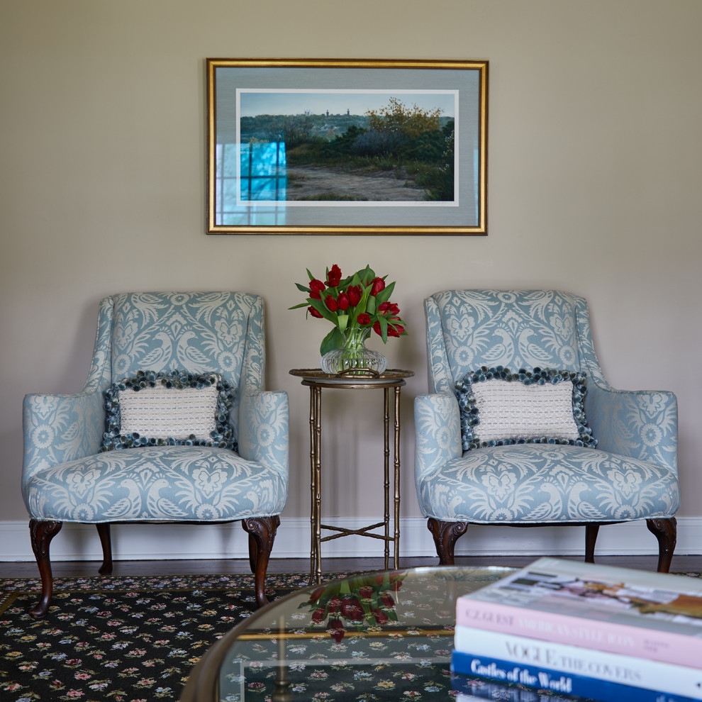 Traditional Rumson Home - Two accent chairs were re-upholstered in a large light blue damask pattern. A brassy metal table positioned centered with a framed acrylic landscape above.