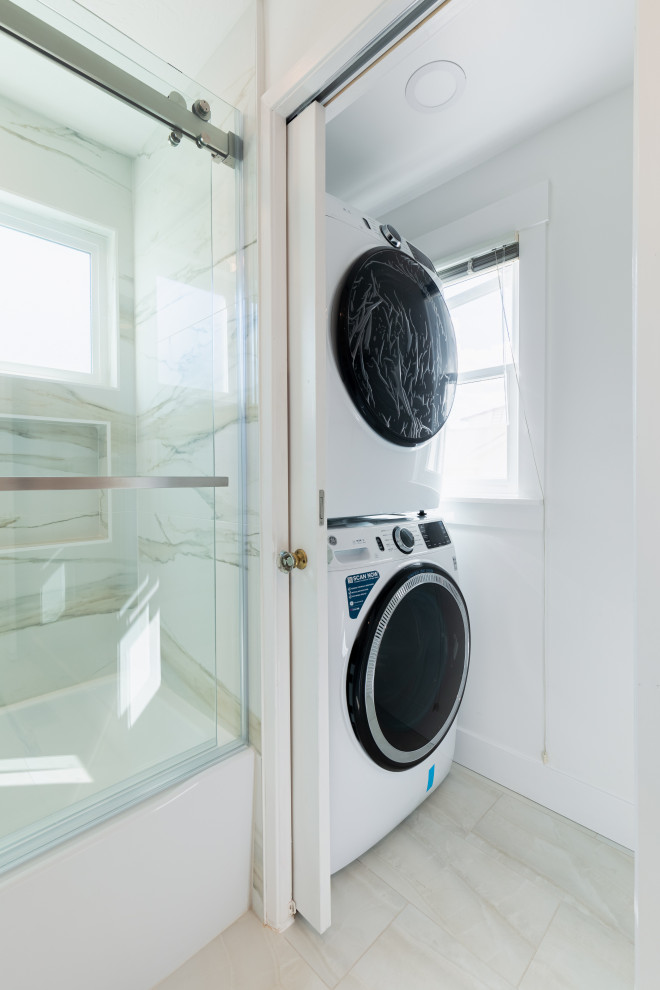 Small transitional single-wall dedicated laundry room in Phoenix with shaker cabinets, white cabinets, white walls, brick walls, a double-bowl sink, quartz benchtops, white splashback, ceramic splashback, ceramic floors, an integrated washer and dryer, white benchtop and beige floor.
