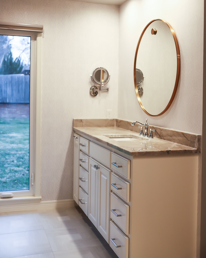 Inspiration for a mid-sized transitional master white tile and marble tile ceramic tile and gray floor alcove bathtub remodel with gray walls, beaded inset cabinets, white cabinets, a two-piece toilet, an undermount sink, quartzite countertops and a hinged shower door
