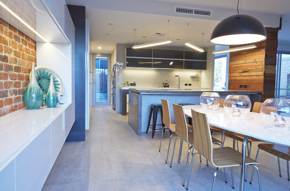 This is an example of a contemporary dining room in Perth with porcelain floors.
