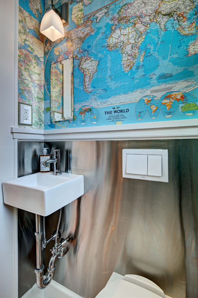 Small eclectic powder room in New York with a wall-mount sink, a wall-mount toilet and multi-coloured walls.