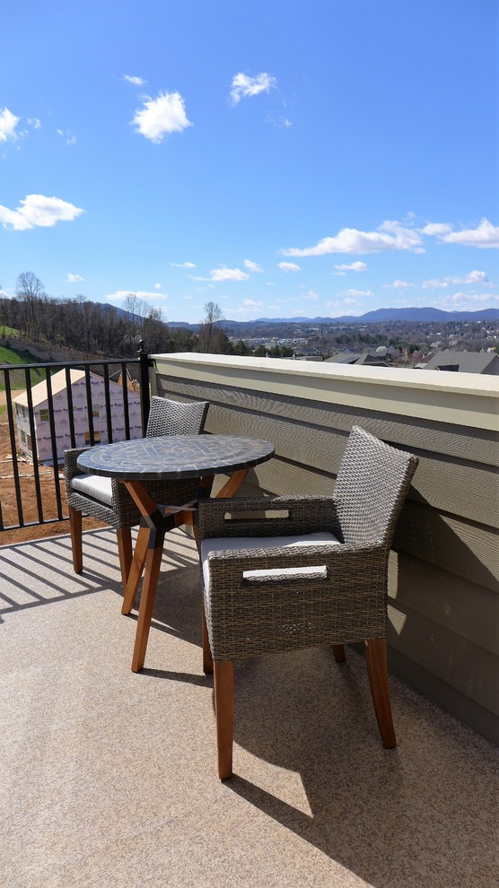 Example of a mid-sized transitional rooftop deck design in Richmond with no cover