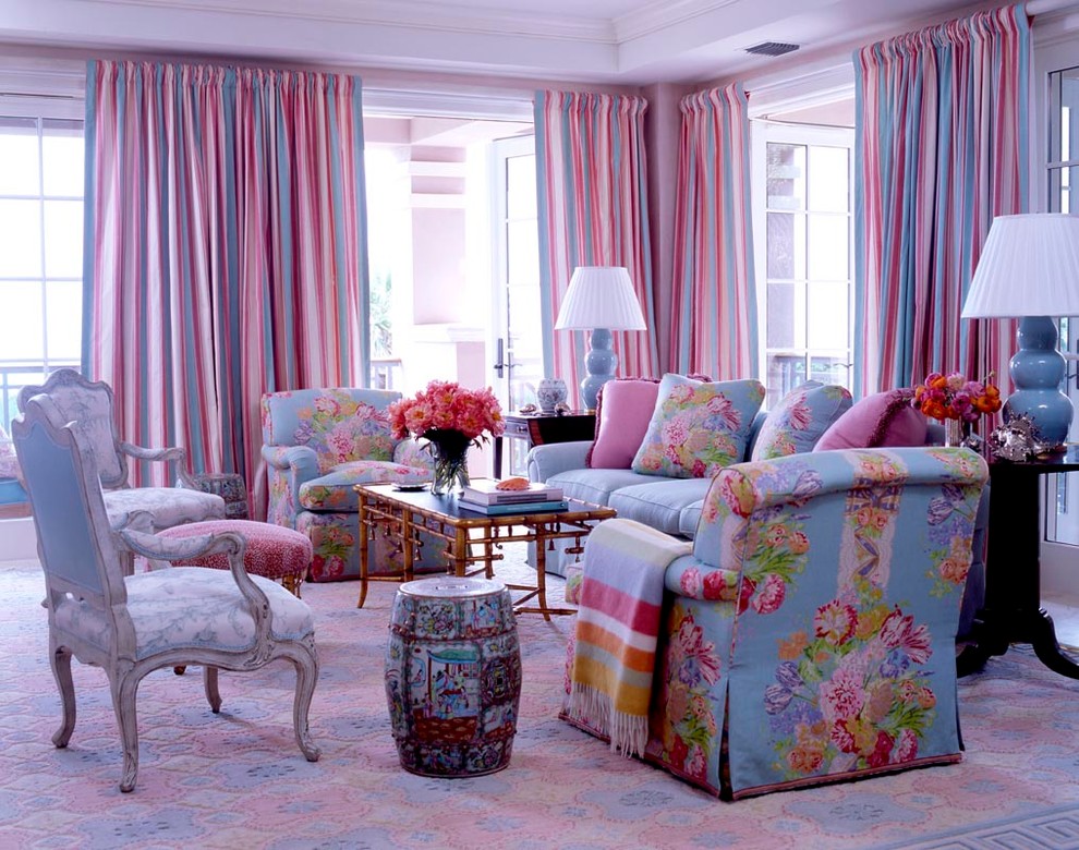 This is an example of a large traditional enclosed living room in New York with carpet and pink walls.