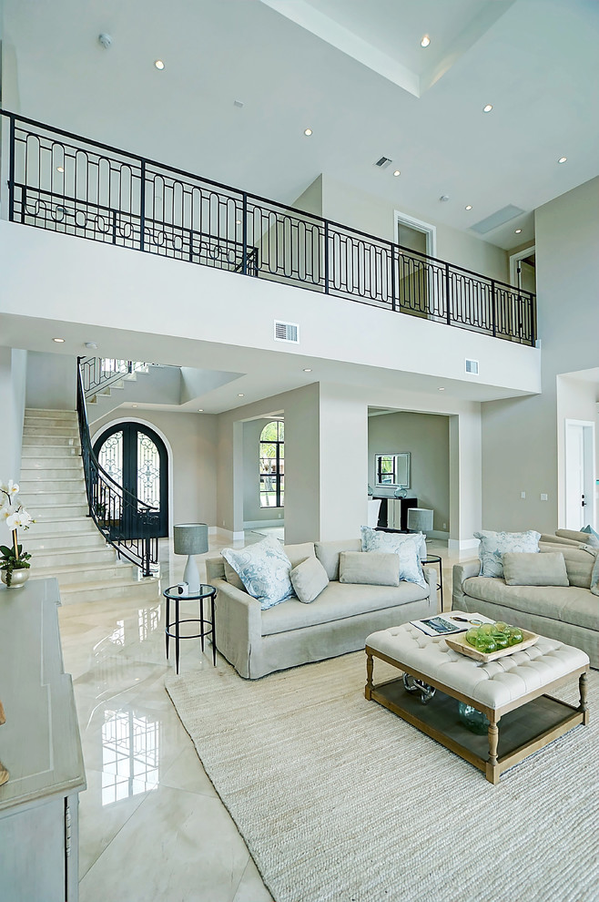 Inspiration for a large mediterranean formal open concept living room in Miami with beige walls, marble floors, no fireplace, no tv and beige floor.
