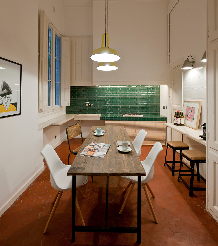 Mid-sized eclectic separate dining room in Barcelona with white walls, terra-cotta floors and no fireplace.