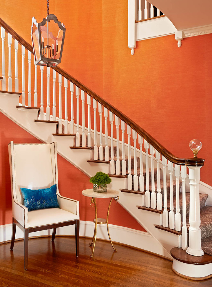 This is an example of a large traditional curved staircase in Charlotte.