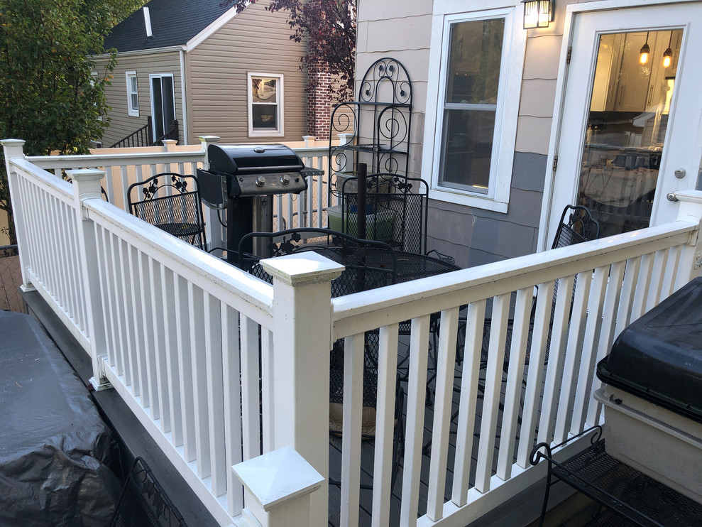 Mid-sized elegant backyard deck photo in Newark with no cover