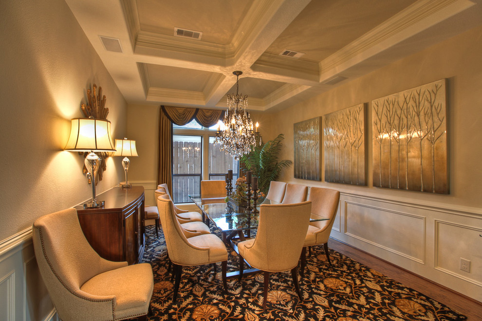 Photo of a traditional separate dining room in Houston with beige walls and dark hardwood floors.