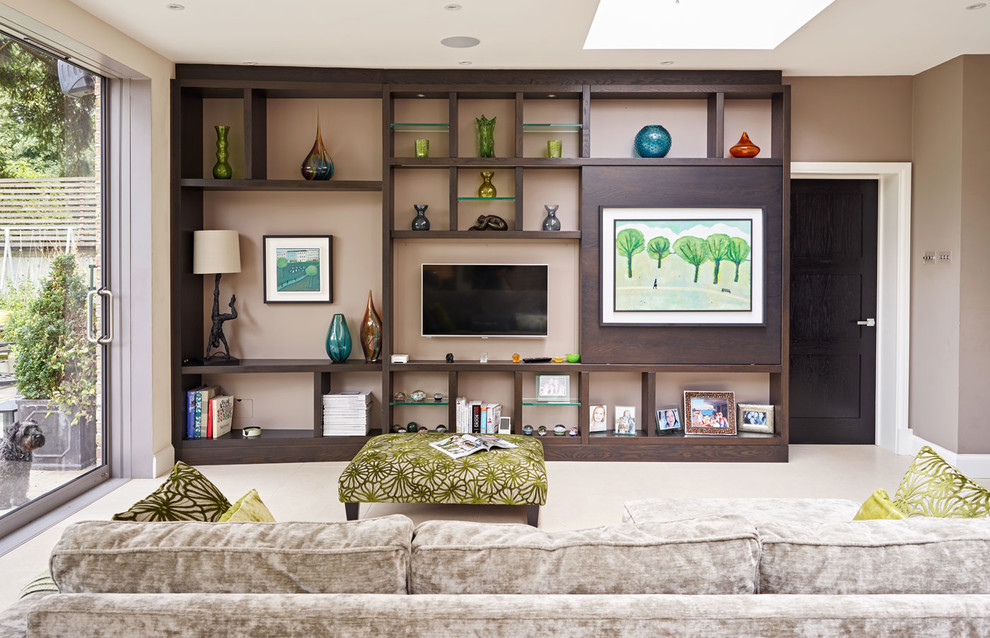 Photo of an expansive asian enclosed living room in London with brown walls and a wall-mounted tv.