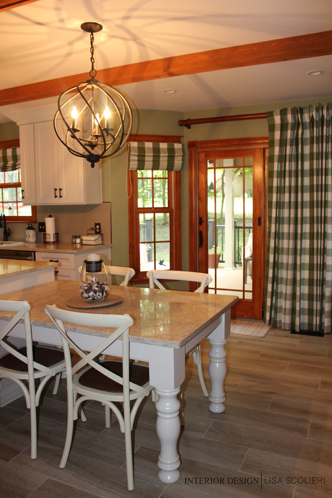 Inspiration for a mid-sized rustic l-shaped ceramic tile and beige floor eat-in kitchen remodel with a double-bowl sink, shaker cabinets, white cabinets, quartz countertops, beige backsplash, ceramic backsplash, stainless steel appliances, an island and beige countertops