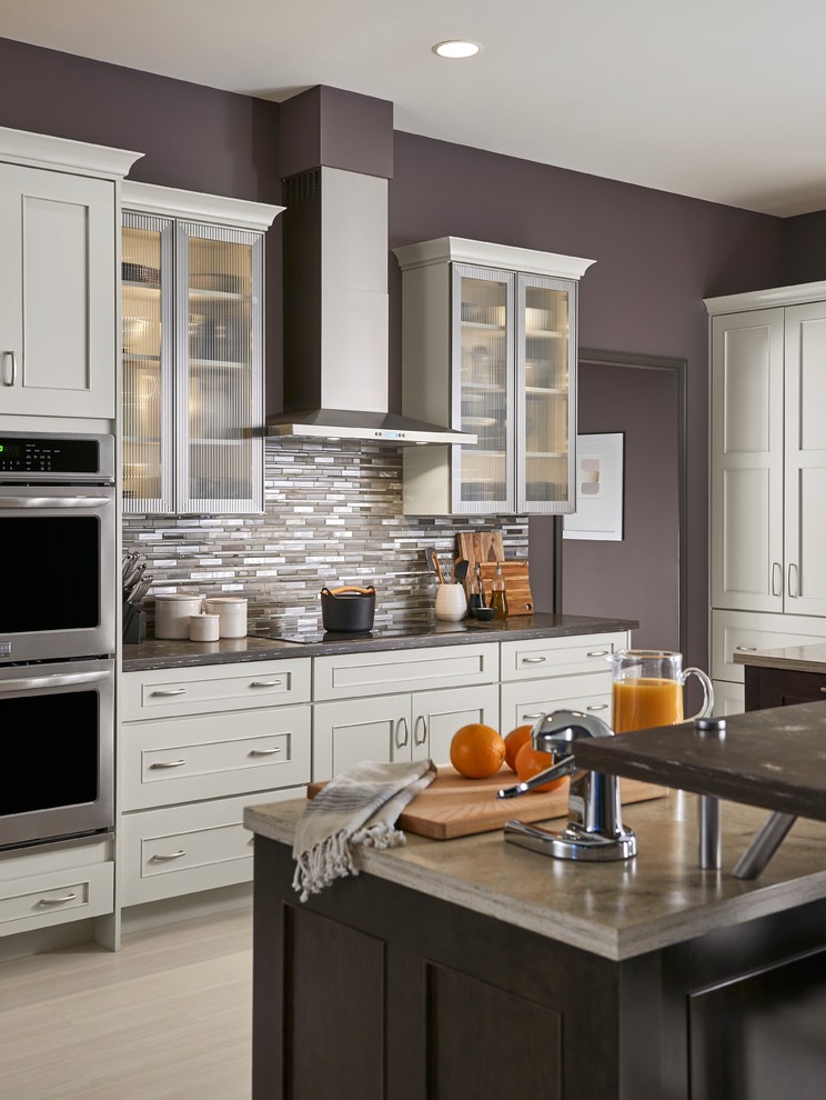 Eat-in kitchen - large transitional l-shaped eat-in kitchen idea with shaker cabinets, white cabinets and an island
