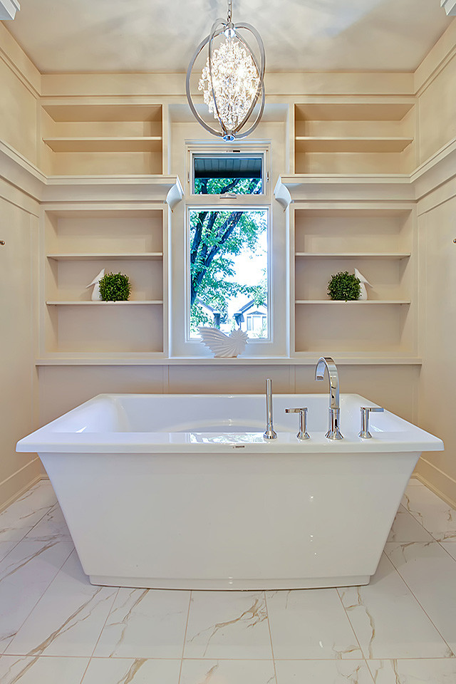 Inspiration for a mid-sized contemporary master bathroom in Calgary with open cabinets, beige cabinets, a japanese tub, white tile, stone tile, beige walls and marble floors.