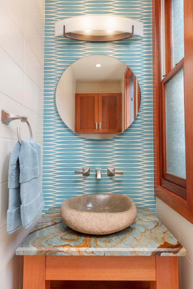 Powder room - small tropical powder room idea in Minneapolis with a built-in vanity