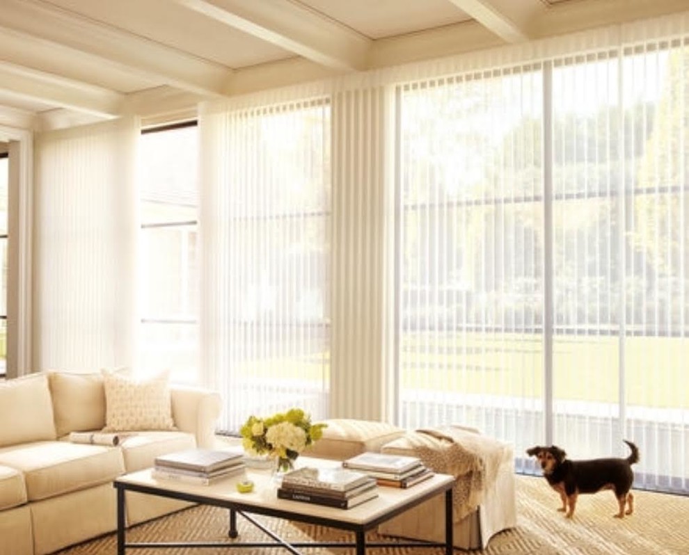 Example of a large transitional open concept carpeted and beige floor living room design in San Francisco with white walls, no fireplace and no tv