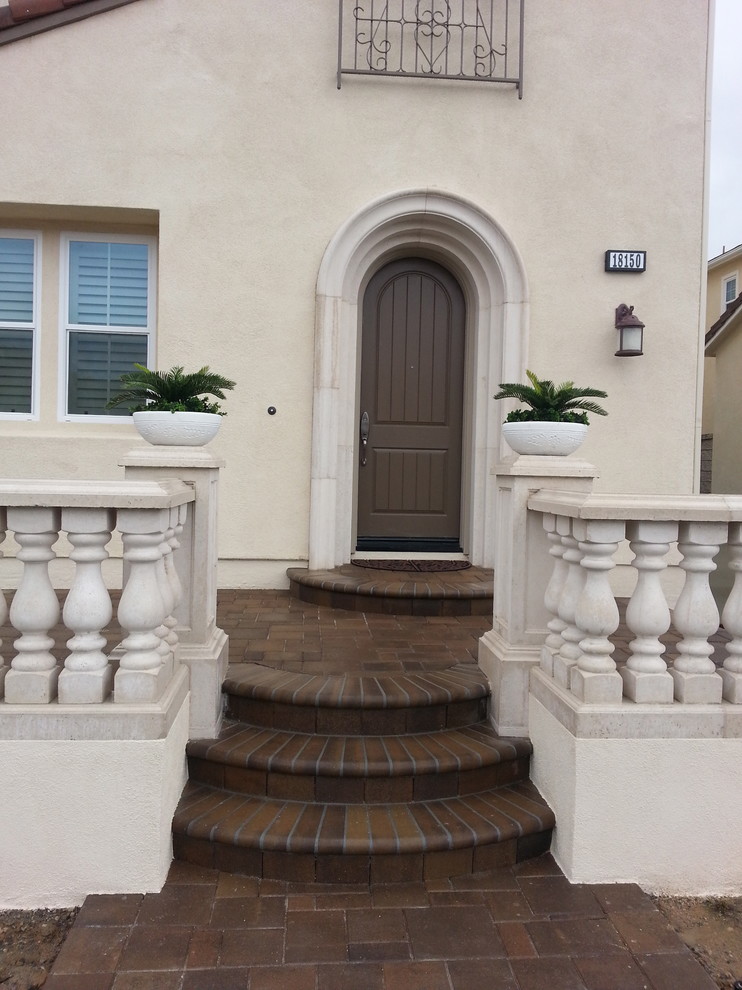 Front door - mid-sized transitional front door idea in Orange County with a brown front door