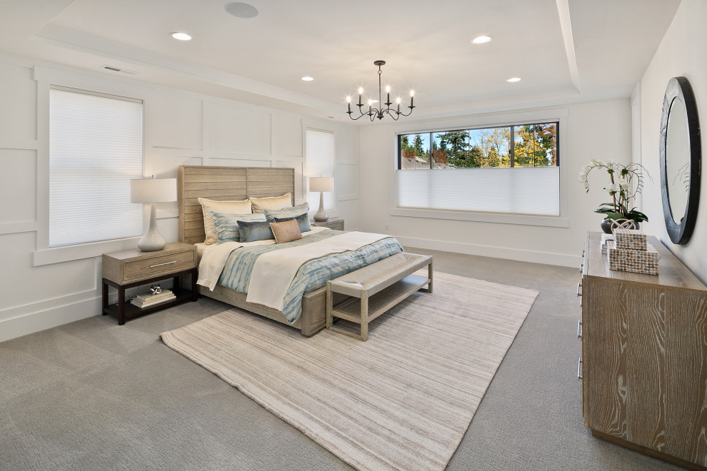 Design ideas for a mid-sized country master bedroom in Seattle with white walls, light hardwood floors, beige floor, recessed and decorative wall panelling.