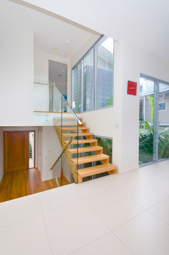 Contemporary wood staircase in Brisbane with open risers.