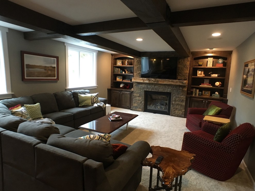 Transitional dark wood floor and brown floor basement photo with gray walls