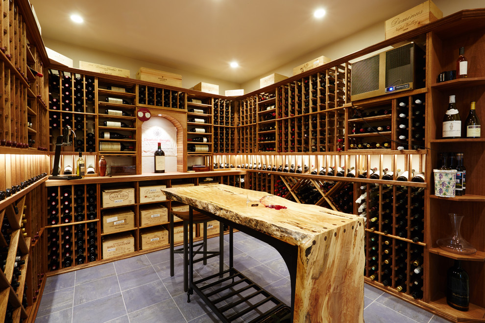 Photo of a large transitional wine cellar in Seattle with ceramic floors and storage racks.