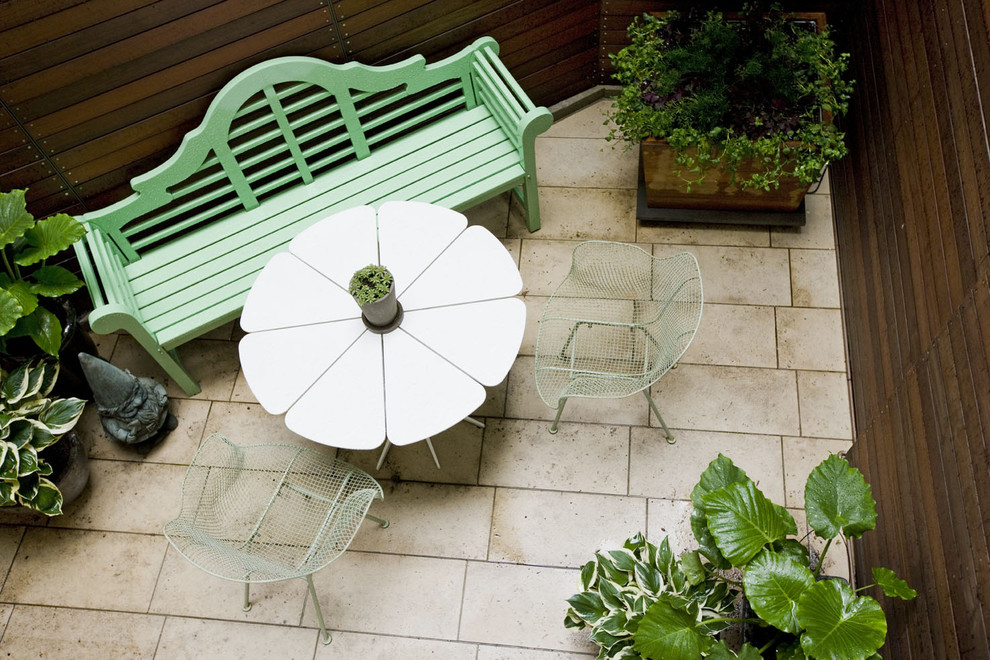 This is an example of a contemporary patio in New York with a container garden.