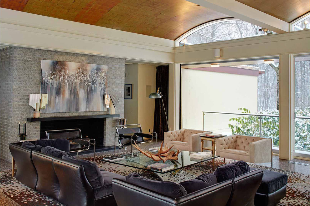 Photo of a contemporary formal living room in New York with beige walls and a standard fireplace.