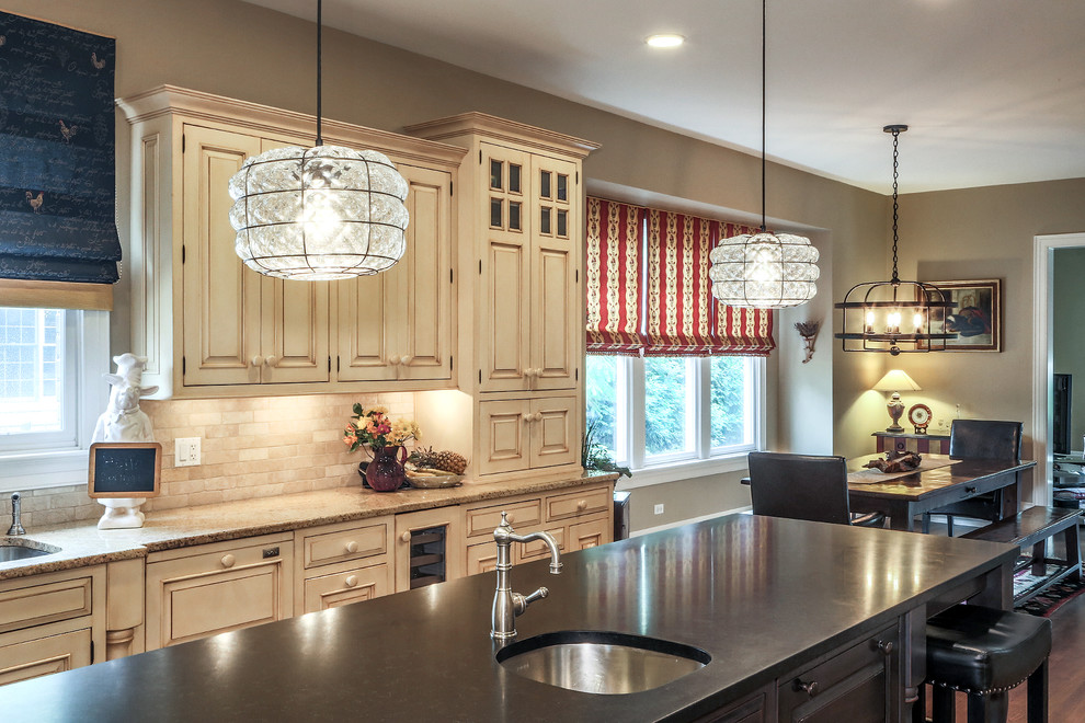 Inspiration for a large country l-shaped separate kitchen in Chicago with an undermount sink, raised-panel cabinets, beige cabinets, concrete benchtops, beige splashback, stone tile splashback, stainless steel appliances, dark hardwood floors and with island.
