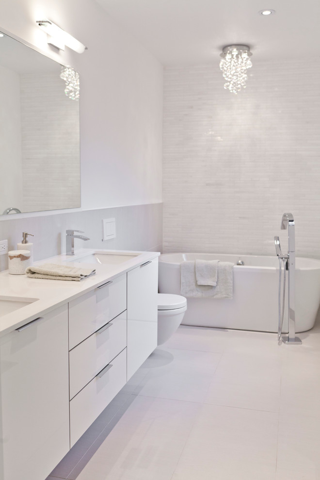 Photo of a modern bathroom in Toronto with a freestanding tub.