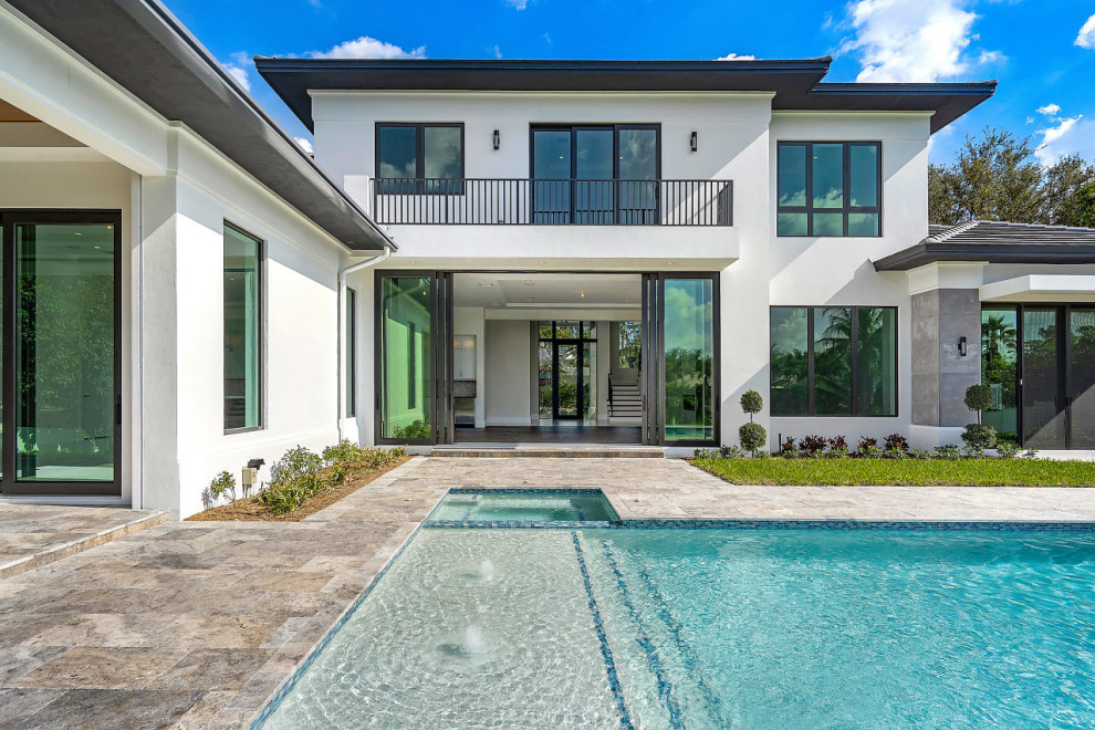 Design ideas for a contemporary two-storey house exterior in Miami.