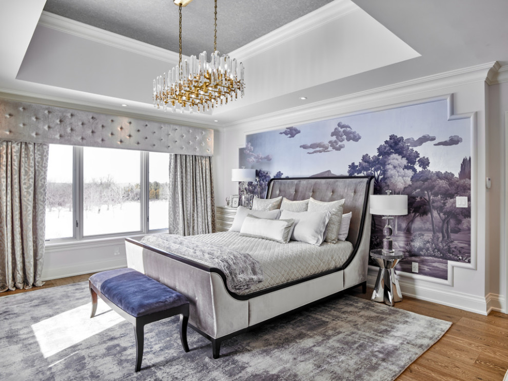 Design ideas for an expansive traditional master bedroom in Toronto with grey walls, medium hardwood floors, brown floor, recessed and wallpaper.