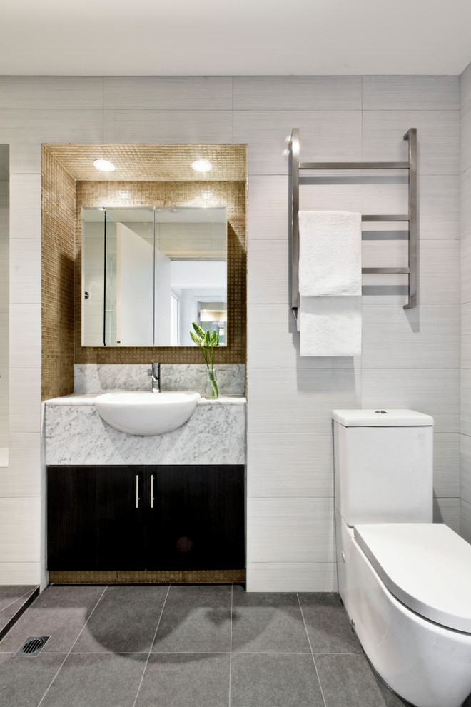 Photo of a small contemporary master bathroom in Melbourne with flat-panel cabinets, dark wood cabinets, marble benchtops, an open shower, a one-piece toilet, brown tile, white walls and ceramic floors.