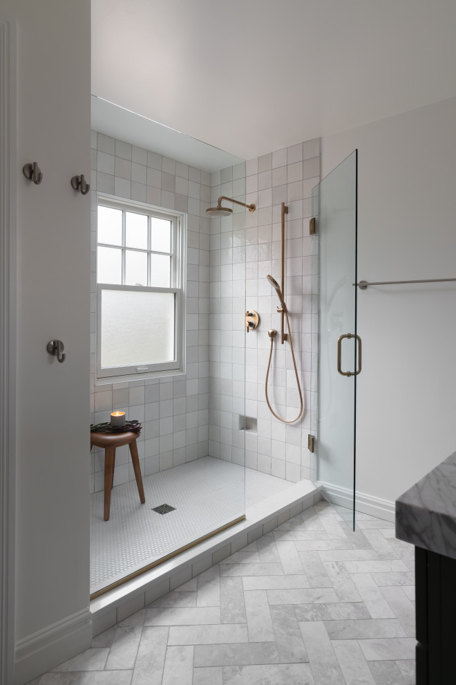 This is an example of a mid-sized modern master bathroom in Detroit with shaker cabinets, green cabinets, an alcove shower, a one-piece toilet, white tile, ceramic tile, white walls, marble floors, an undermount sink, quartzite benchtops, grey floor, a hinged shower door, grey benchtops, a niche, a double vanity and a built-in vanity.
