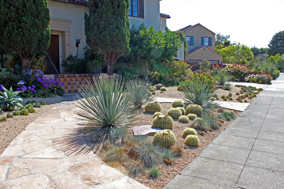 This is an example of a large front yard xeriscape in San Francisco with concrete pavers.