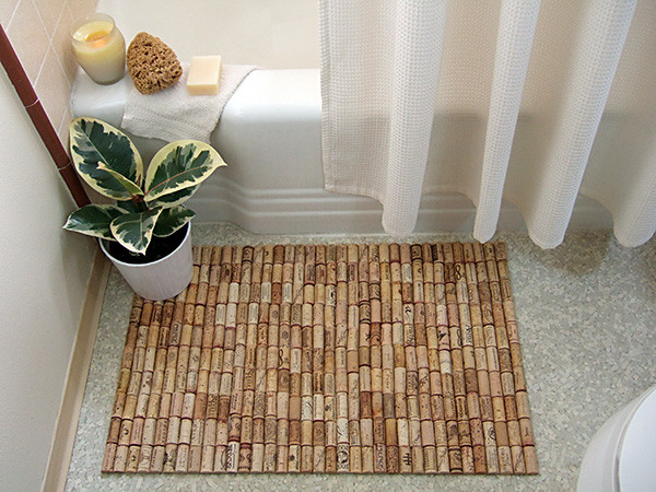 When I step out of the shower, what makes the tile floor so much colder  than the bathroom mat?