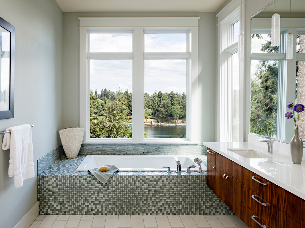 Inspiration for a large transitional master bathroom in Portland with an undermount sink, flat-panel cabinets, dark wood cabinets, a drop-in tub, multi-coloured tile, mosaic tile, grey walls, ceramic floors, engineered quartz benchtops and white floor.