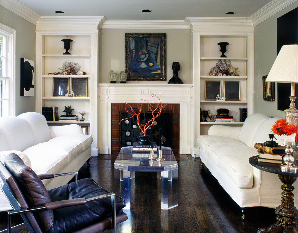 This is an example of a transitional formal living room in Los Angeles with dark hardwood floors, a standard fireplace, a brick fireplace surround and no tv.