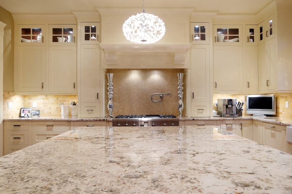 Example of a transitional kitchen design in Calgary