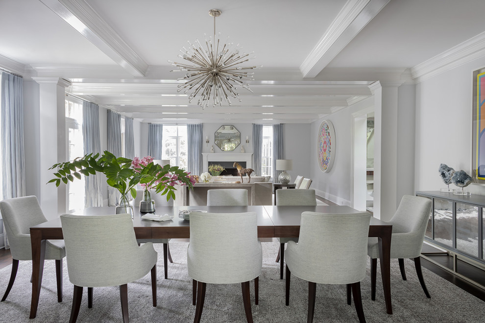 Example of a large transitional coffered ceiling great room design in Boston with gray walls, a standard fireplace and a plaster fireplace