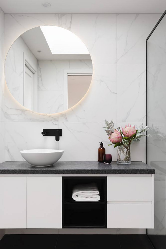 Design ideas for a contemporary bathroom in Melbourne with flat-panel cabinets, white cabinets, white tile, a vessel sink, black floor, grey benchtops, a single vanity and a floating vanity.