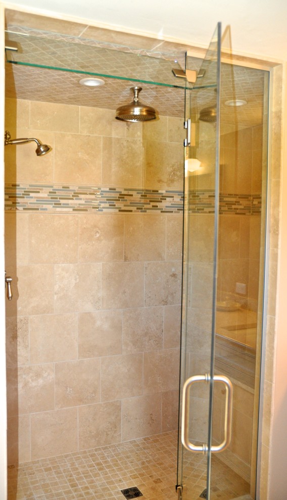 Inspiration for a large transitional master beige tile and ceramic tile ceramic tile and beige floor alcove shower remodel with a hinged shower door