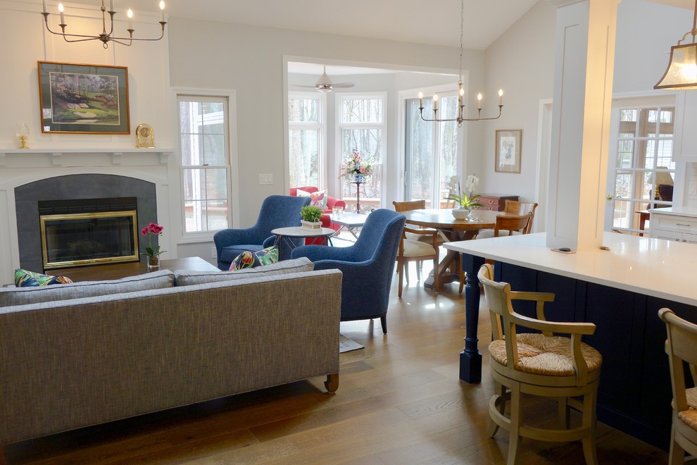 Large transitional galley medium tone wood floor and brown floor eat-in kitchen photo in Cleveland with an undermount sink, shaker cabinets, white cabinets, quartzite countertops, white backsplash, subway tile backsplash, stainless steel appliances and a peninsula