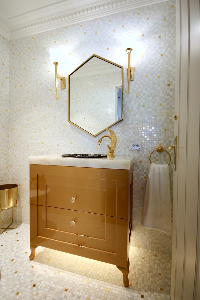Design ideas for a mid-sized traditional powder room in Sydney with recessed-panel cabinets, yellow cabinets, a one-piece toilet, white tile, mosaic tile, white walls, mosaic tile floors, a drop-in sink, marble benchtops, multi-coloured floor and multi-coloured benchtops.