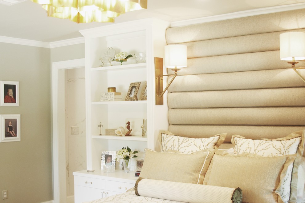 Example of a large transitional master bedroom design with beige walls