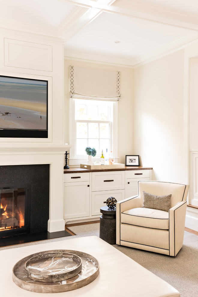Example of a transitional beige floor kitchen design in Boston with beige walls, a standard fireplace and a media wall